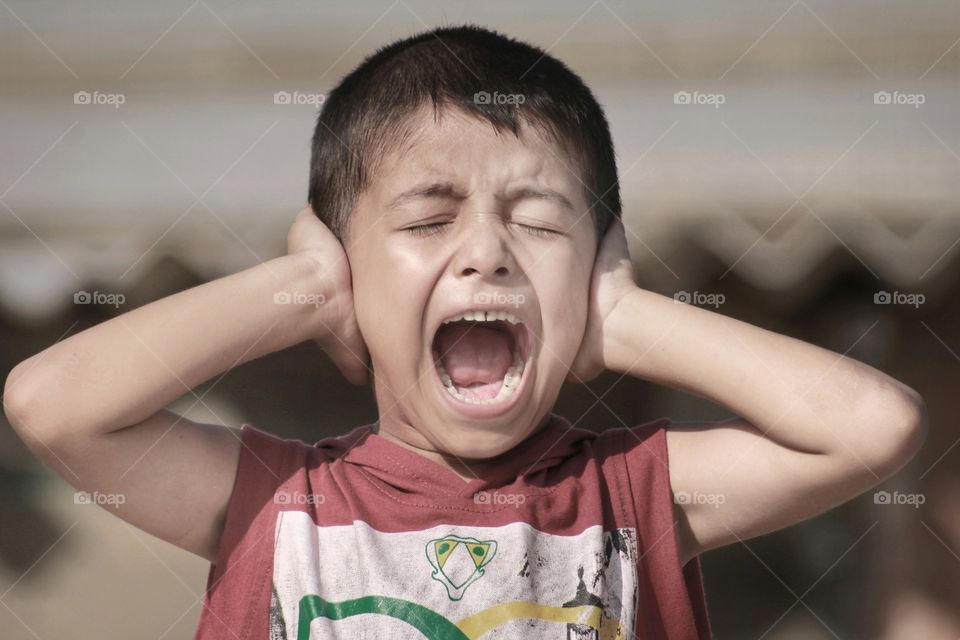 Portrait of shouting boy