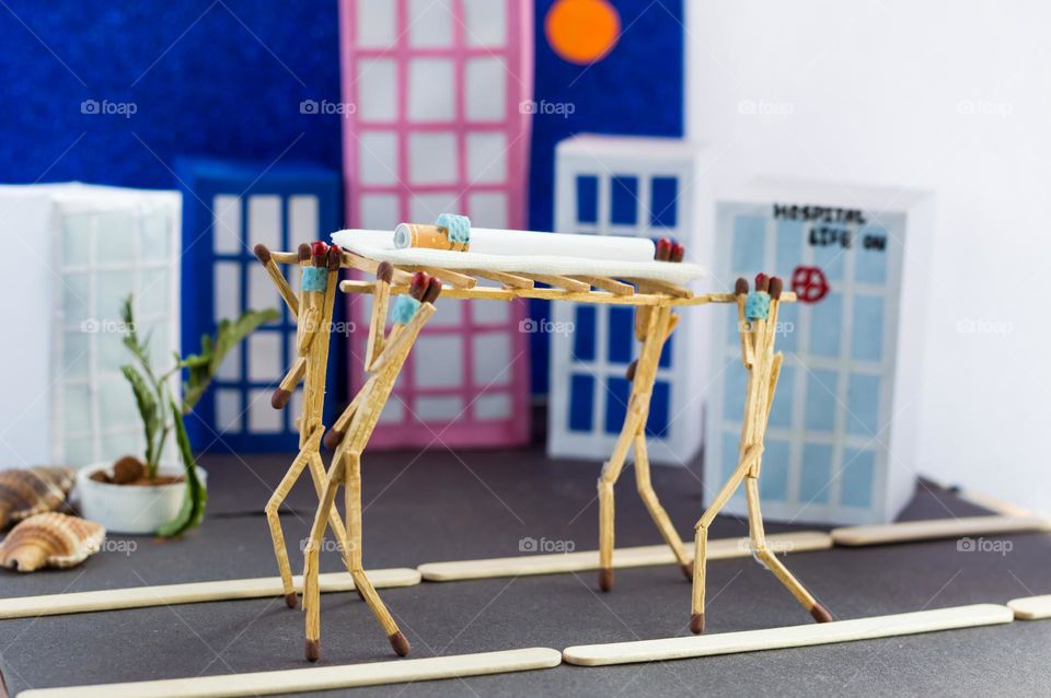 Diy matchstick dolls.Paper buildings in the background. Hospital theme.