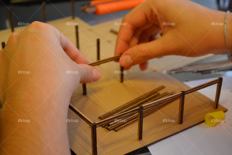 Architecture student building a model