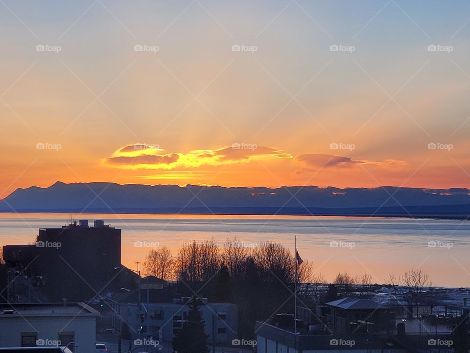 a sunset over the bay, as seen from the hilton hotel in Anchorage Alaska.