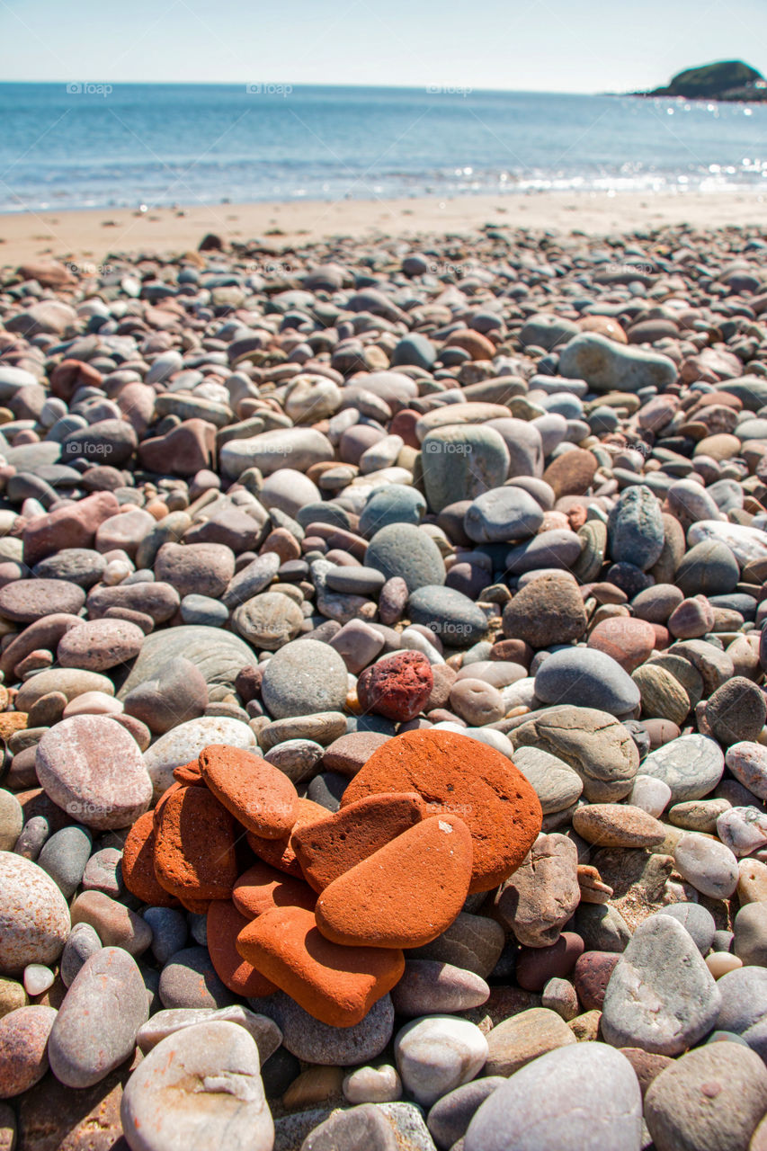 Heart shape made of stone on beach