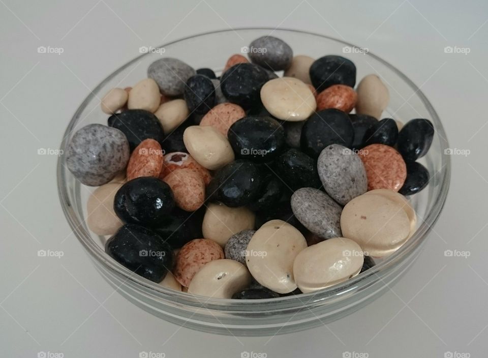 a bowl of candy stones. a bowl of candy stones