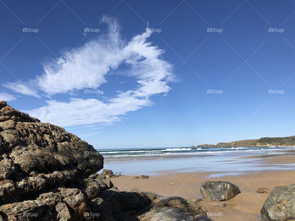 Emerald Beach New South Wales AUSTRALIA beach landscape near Coffs Harbour blue sky and calm surf