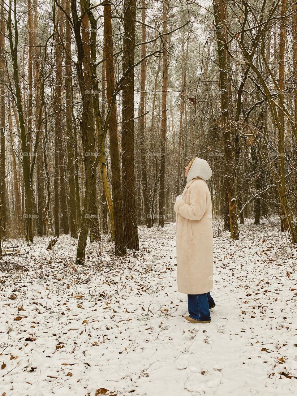 A woman alone in a winter forest