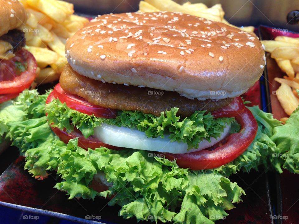 Delicious Berger and French fried on plate