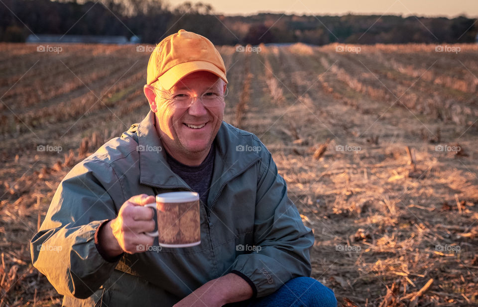 Foap, People of the World: A man takes a moment to enjoy the peaceful early morning sunshine on a farm in North Carolina. 