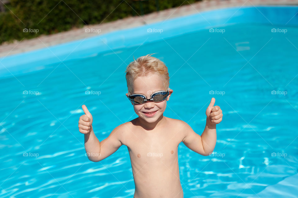 Happy boy in the pool 