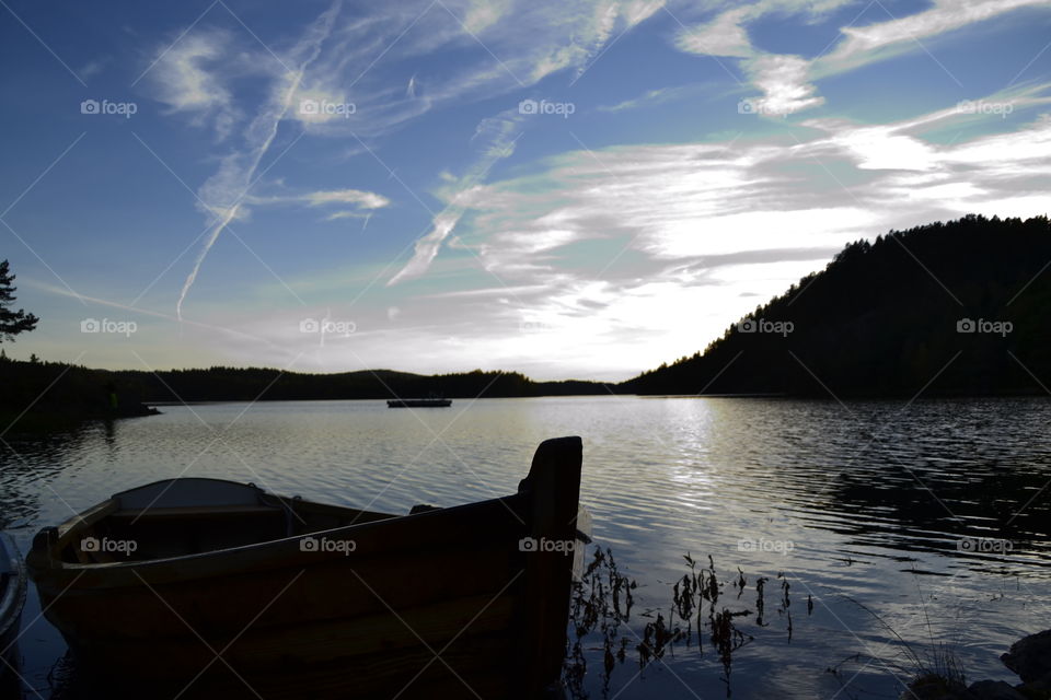 Boat on lake . Boat in front of lake in afternoon 
