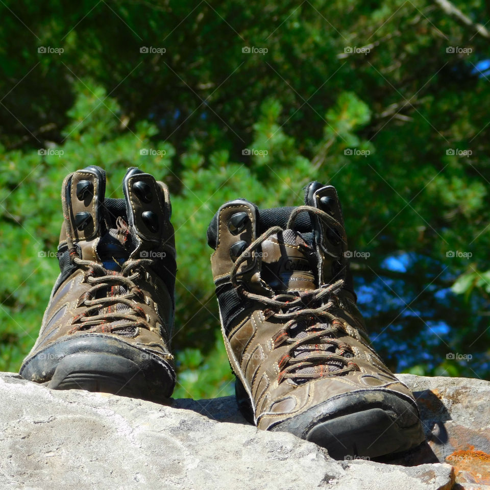 The boots were old. The leather had since cracked and aged. The toes were scuffed and they were falling apart at the seams. The boots had long lived their life of travel,work,joy, and love. After their final journey, it was time to throw them away. It was hard to say GOODBYE!