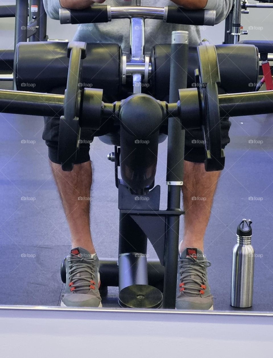 seated calve raises. targeting the inner and outer calve muscle.