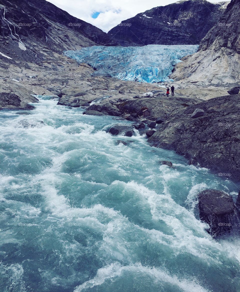 Glacier Nigardsbreen and waterfall in Norway