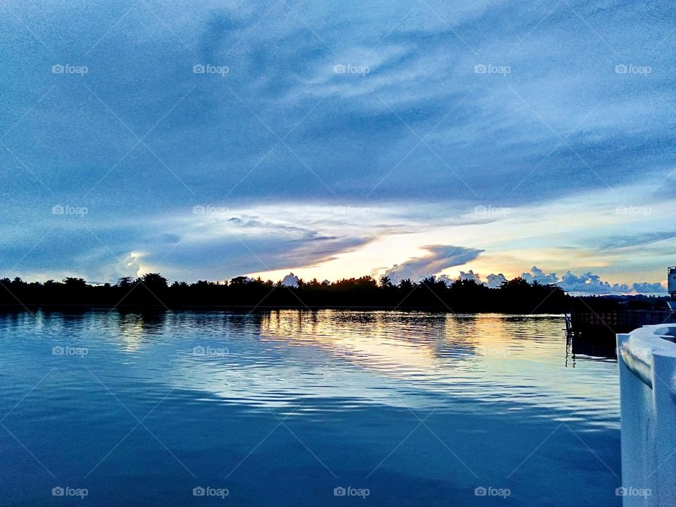 I see skies & sea that blue with a relaxing and naturally beautiful art of nature painted in the horizon.