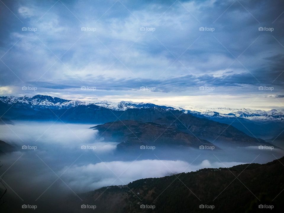 clouds between the mountains.