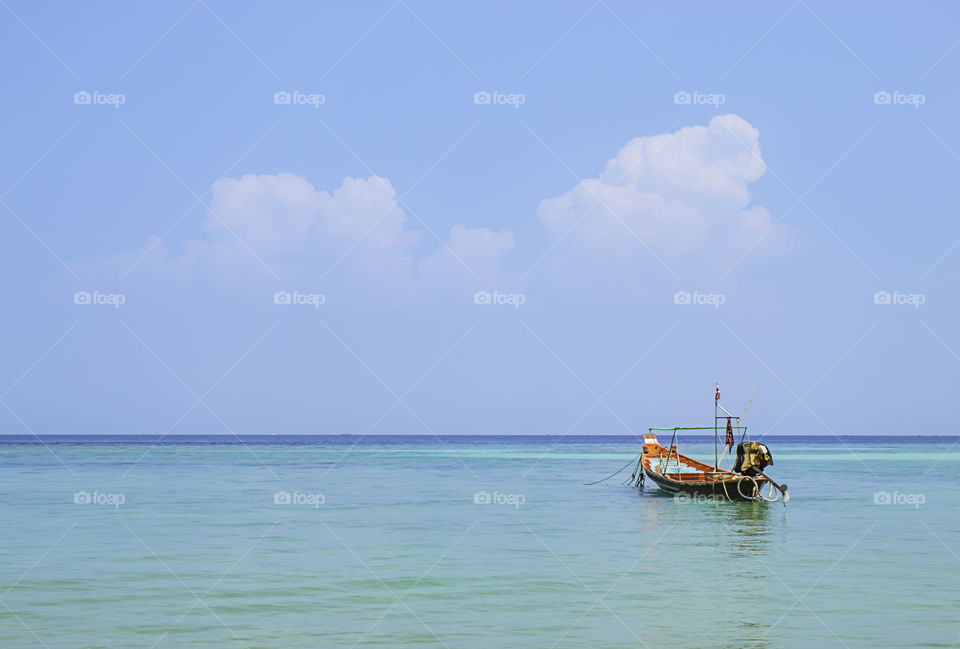 Fishing boats moored in the sea and the beauty of the sky in summer at Haad salad , koh Phangan, Surat Thani in Thailand.