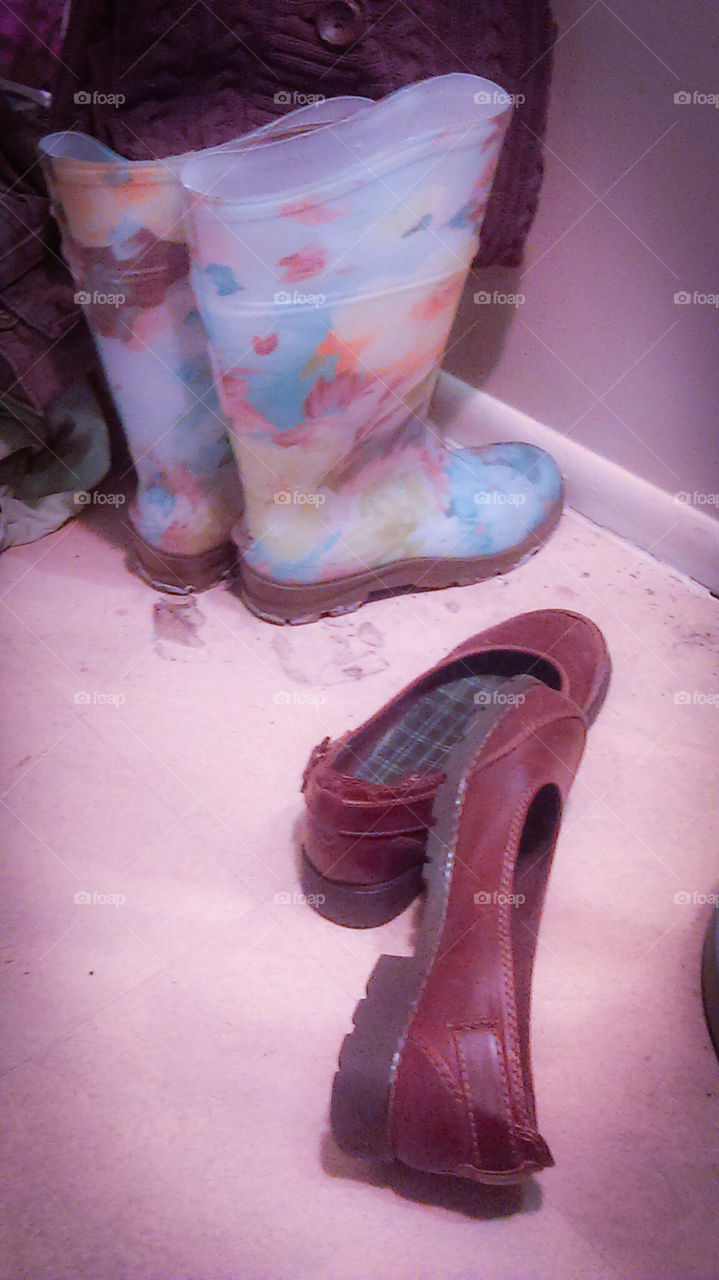 shoes and rainboots in the corner