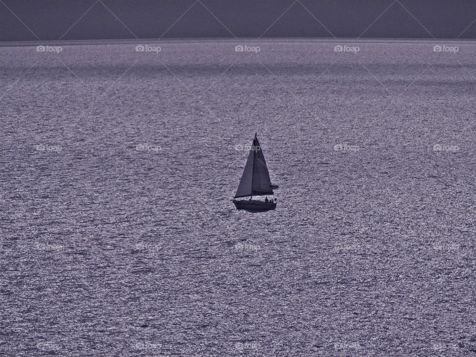 
Sailing in the vast, open and lonely sea - The aim of minimalist photography is to express a concept, in order to bring forth a distinctive visual experience or elicit an emotional response from  