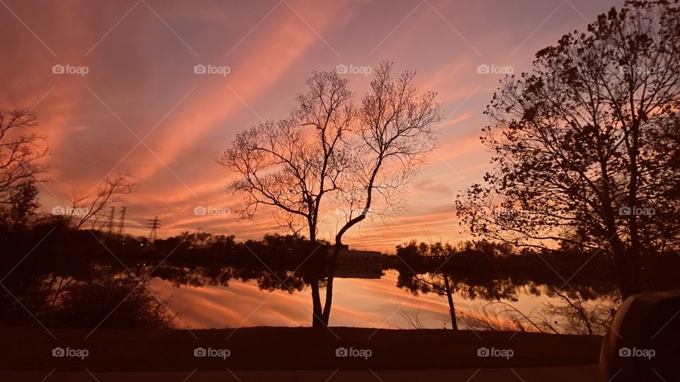 Late in the twilight sun rays formed gorgeous colors cascading from Sky to reflections on lake waters making an extremely Beautiful sunset.