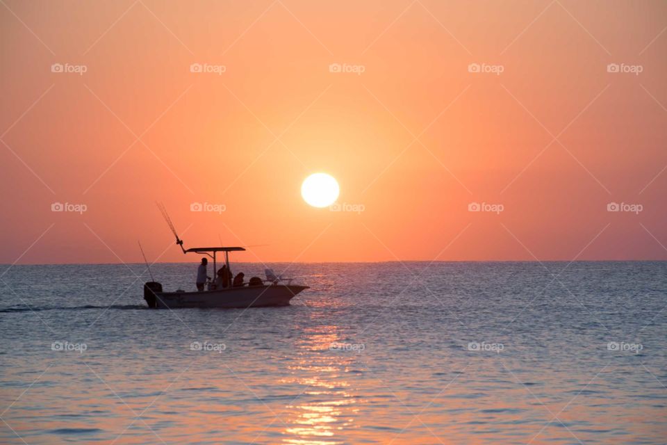 Silhouette of a boat in the ocean 