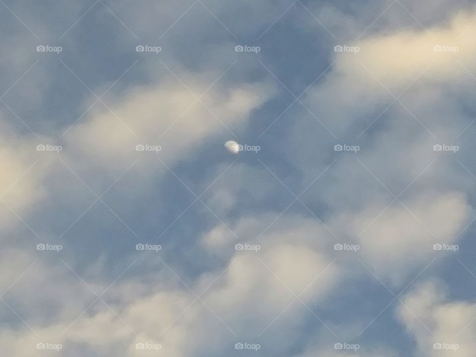 half moon in clouds