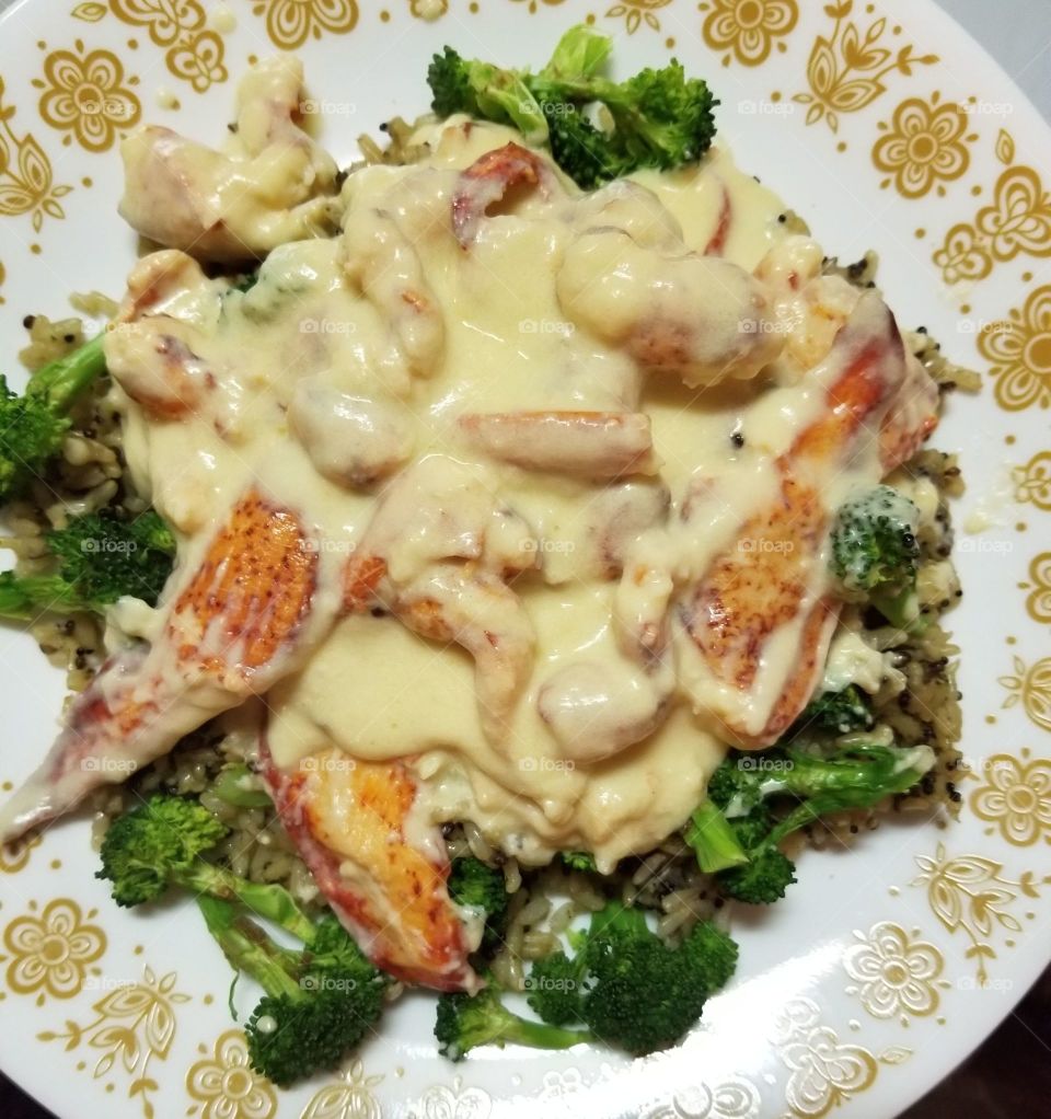 Lobster in Mornay sauce, with steamed brocolli, and garlic & herb quinoa and brown rice. A warm, confort food for a 25 degree Farenheit evening, here on Cape Cod in New England.