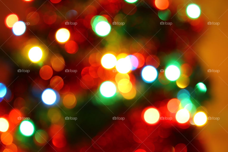 Macro shot of Christmas tree decorations and vivid lights