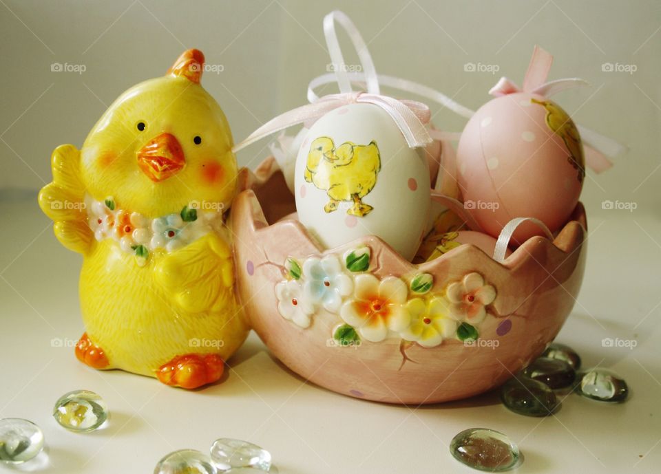 Easter eggs in a vase with a chicken