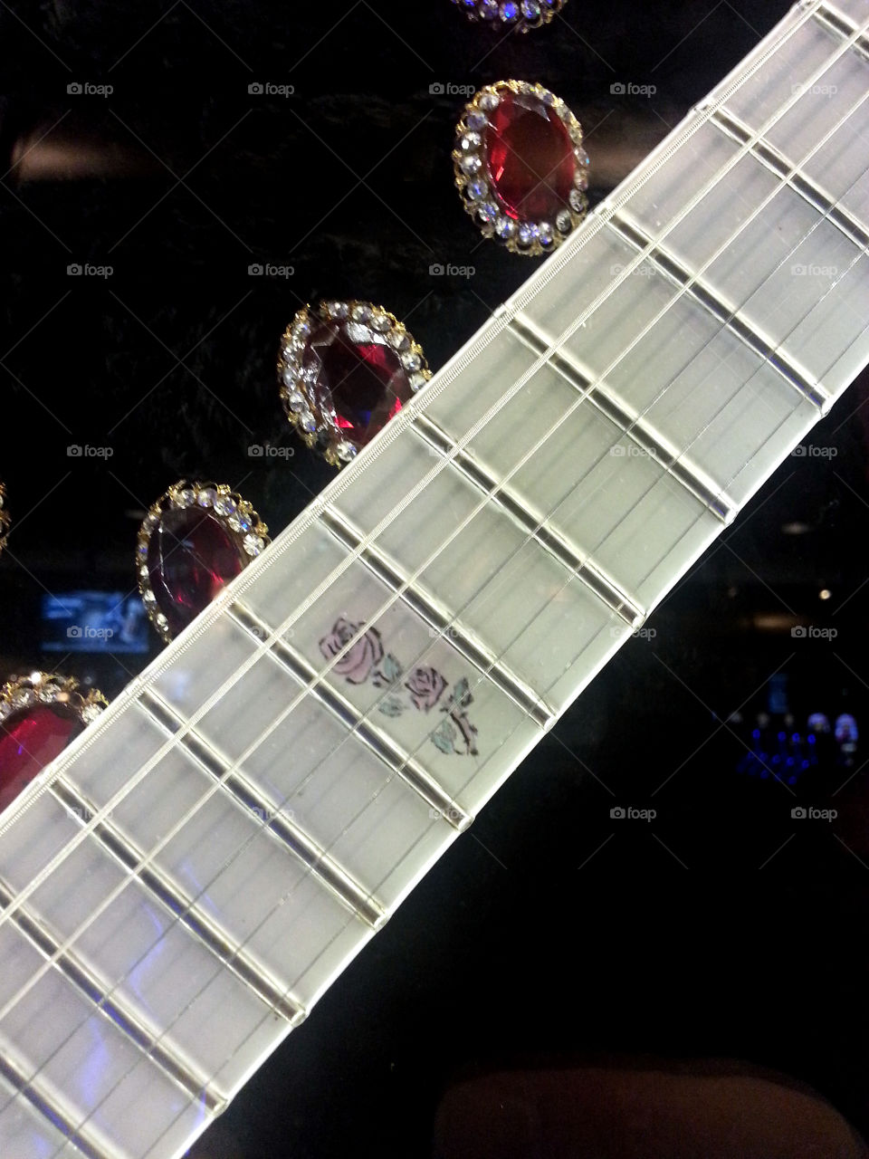 Close Up of Prince's Guitar (with jacket buttons behind it). Hard Rock Casino, Las Vegas,Nevada