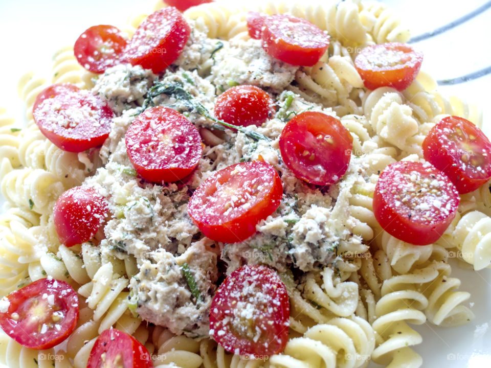 Closeup of a plate of salmon pasta salad.