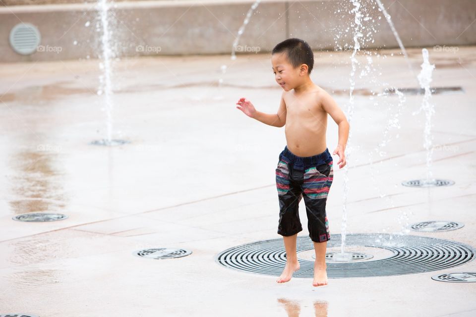 Boy playing water