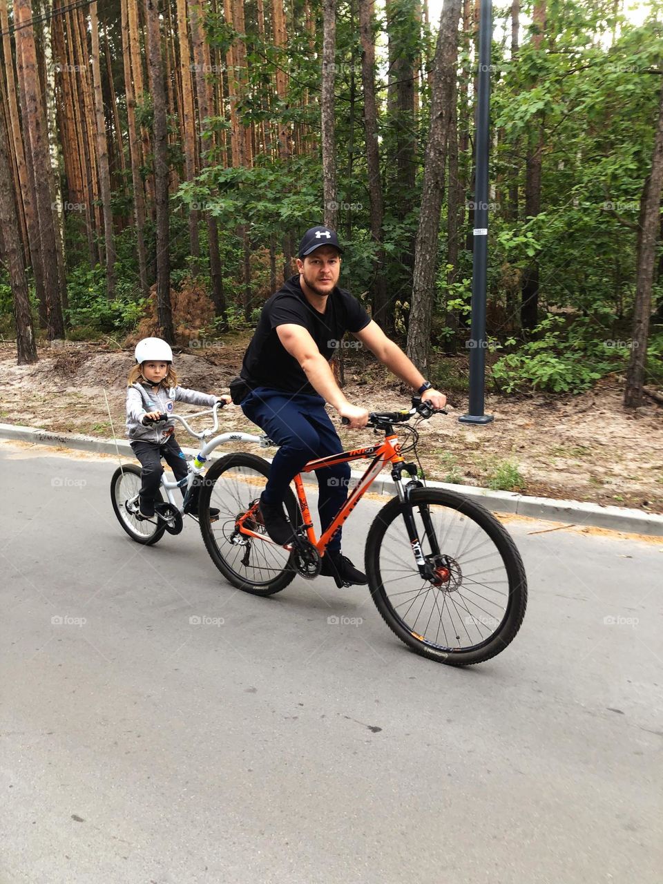 Riding on a bike with a son