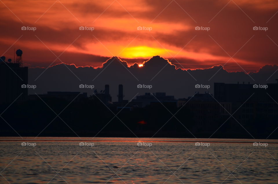 Sunset behind clouds and Madison skyline