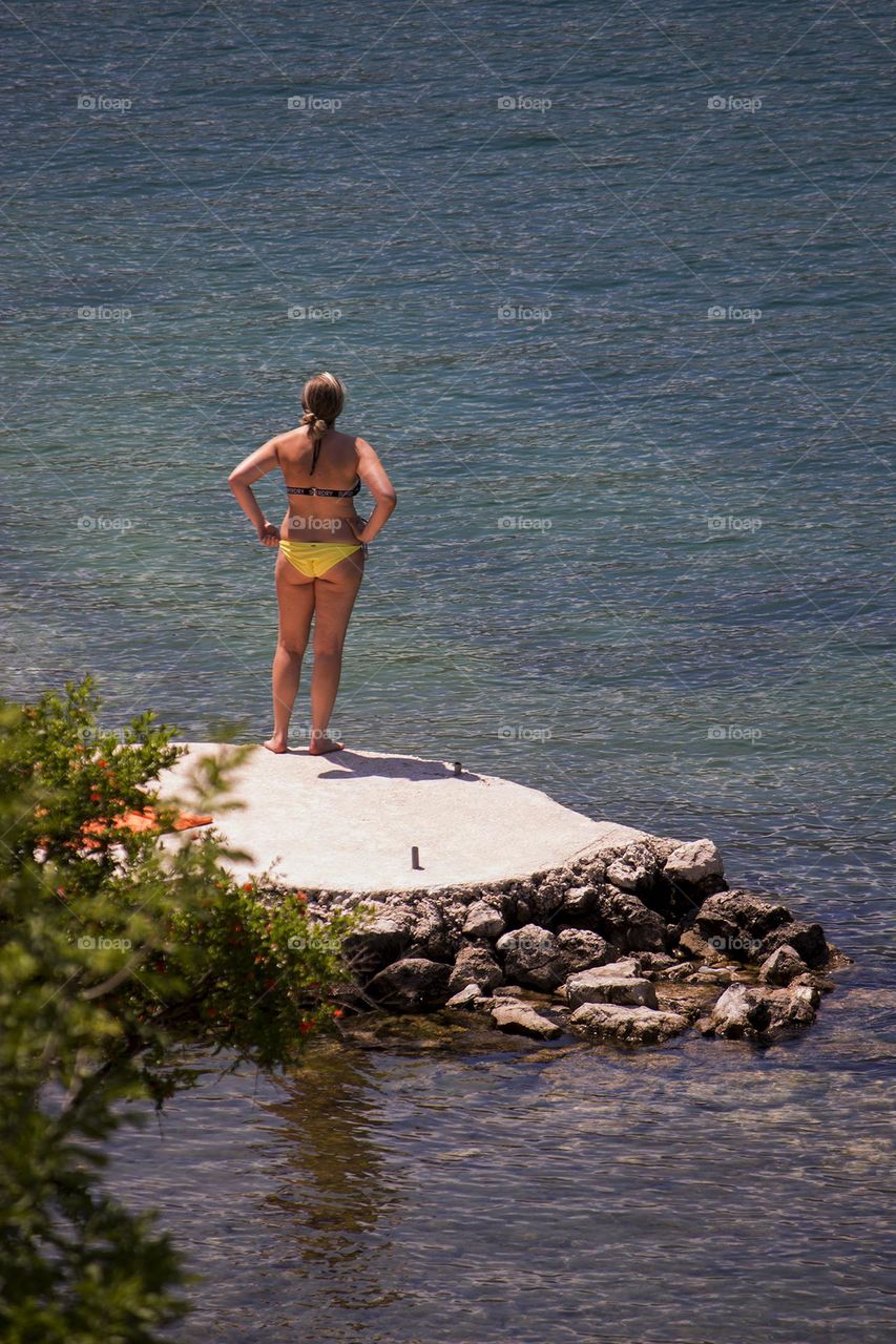 Woman standing on the dock