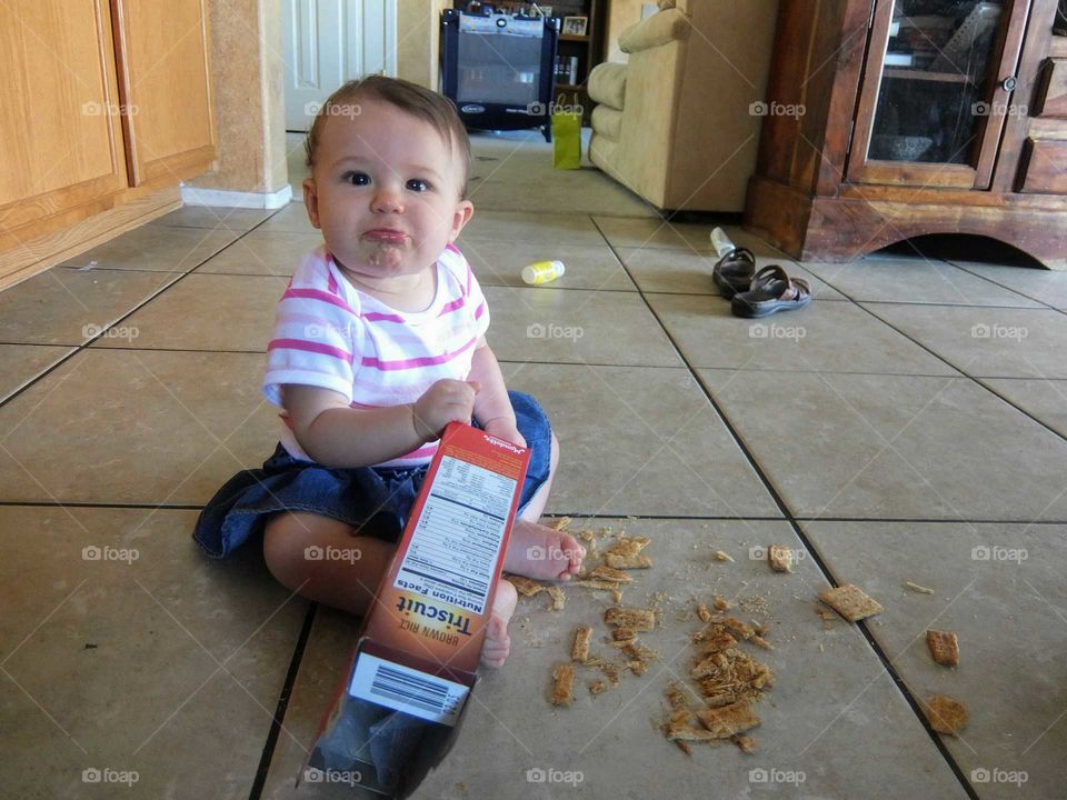 Baby eating crackers