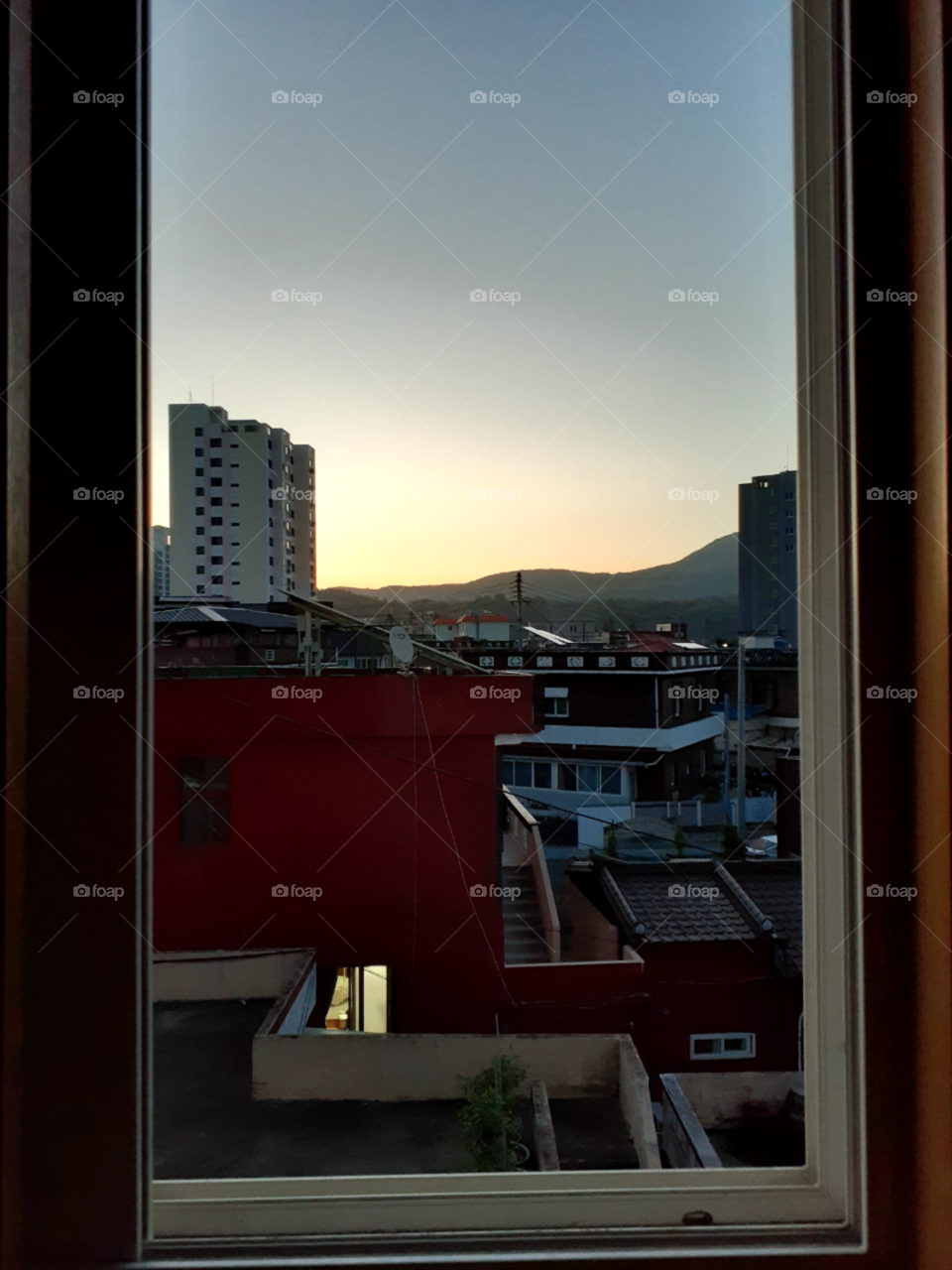 a view from our window in the early morning. its summer time and the sunrise really looks so colorful and beautiful.