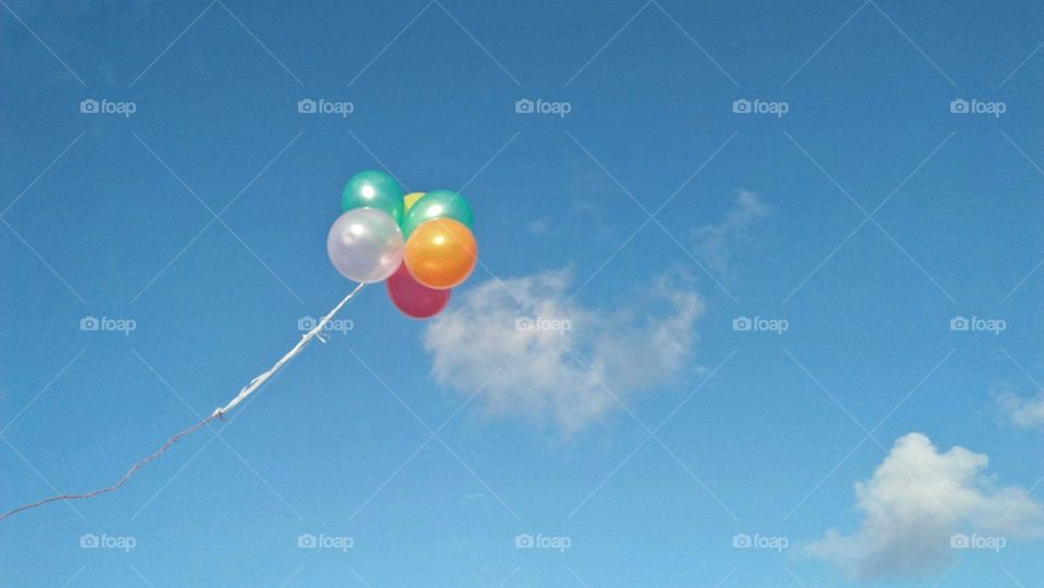 Beautiful and multicolor balloons embraced blue high sky at essaouira city in Morocco.