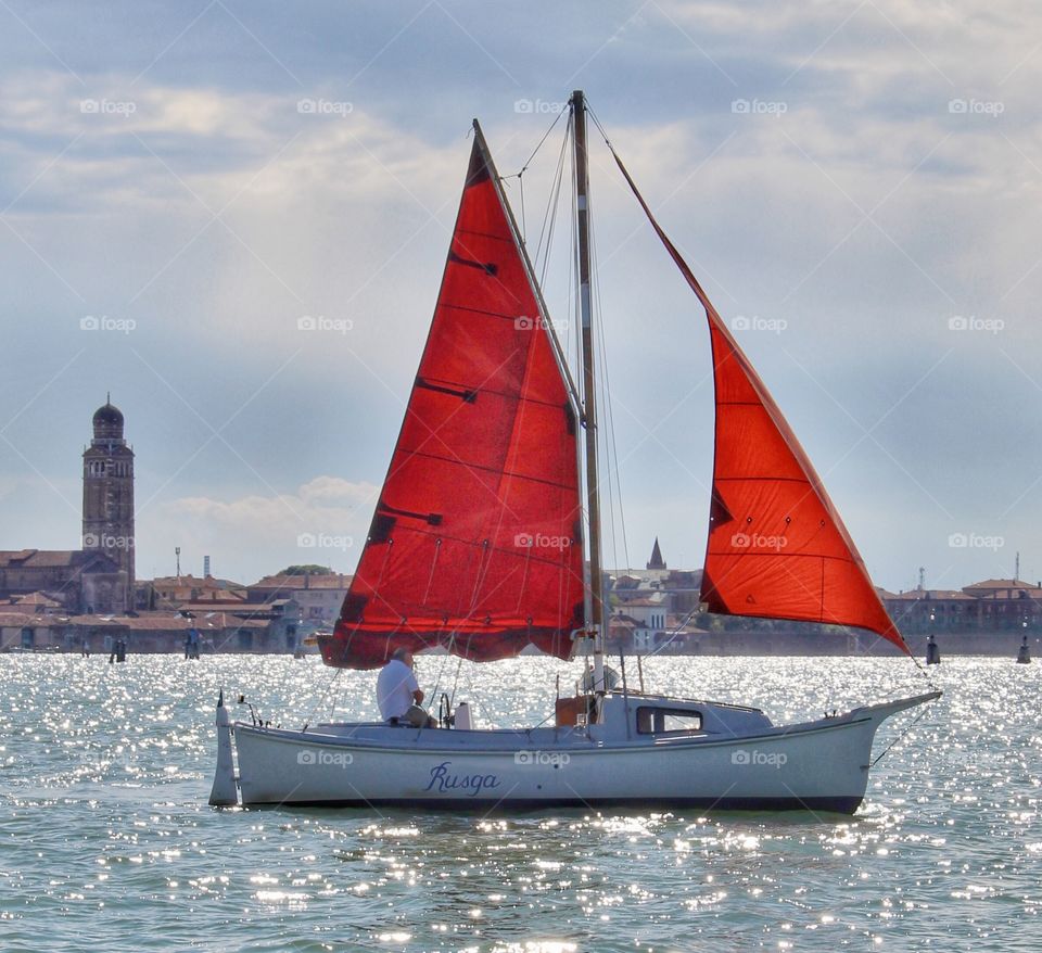 Sailboat on the lagoon in Venice