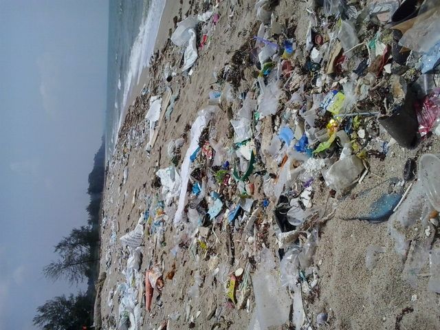 dirty beach full of rubbish,trash . sad reality 