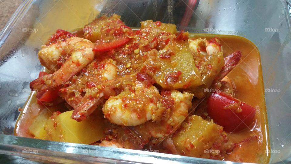 Delicious tomato chilli prawns stir fried with pineapple cube.