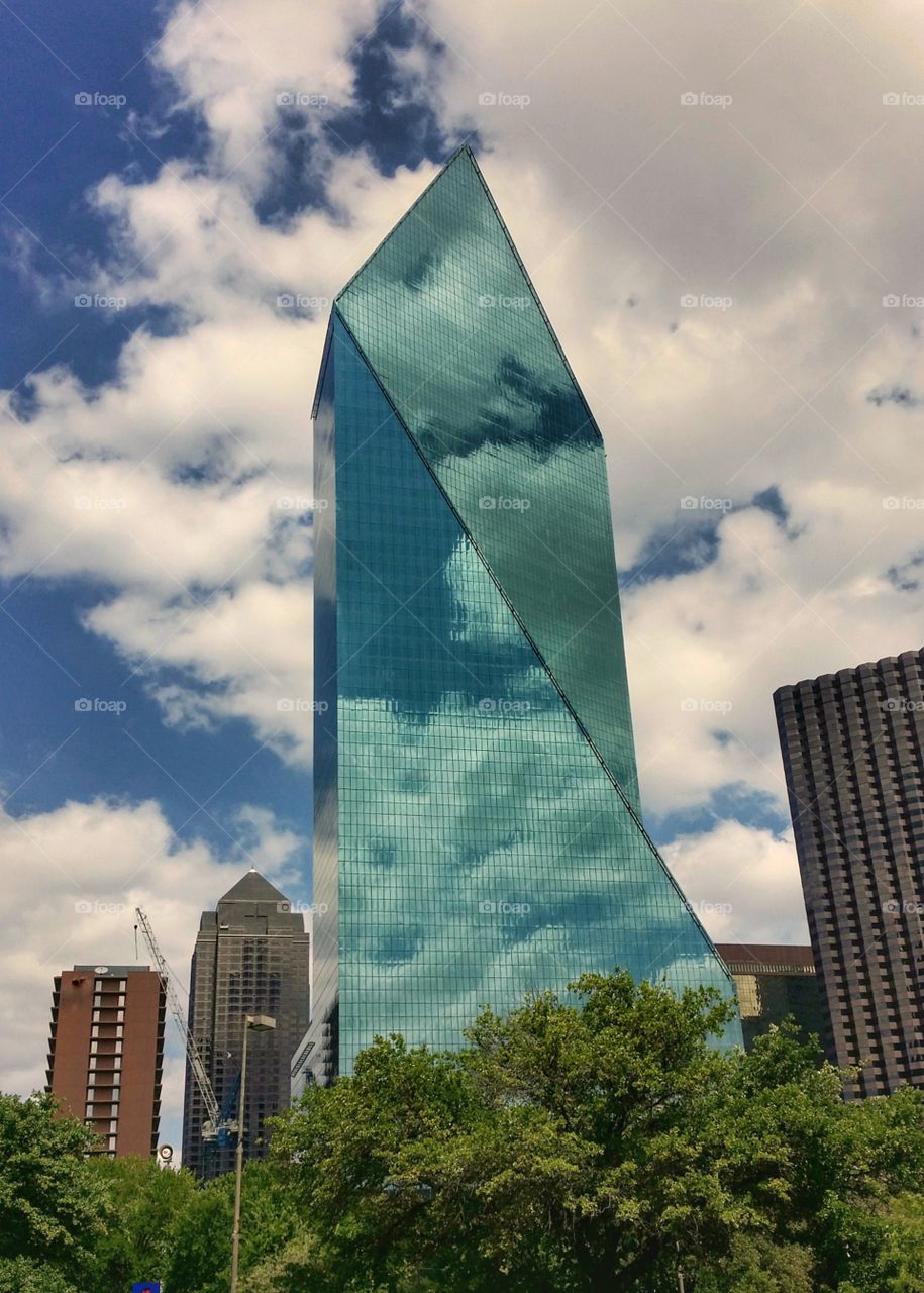 Fountain Place downtown Dallas Texas USA fifth tallest building in Dallas and beautifully reflects the sky with dramatic effect