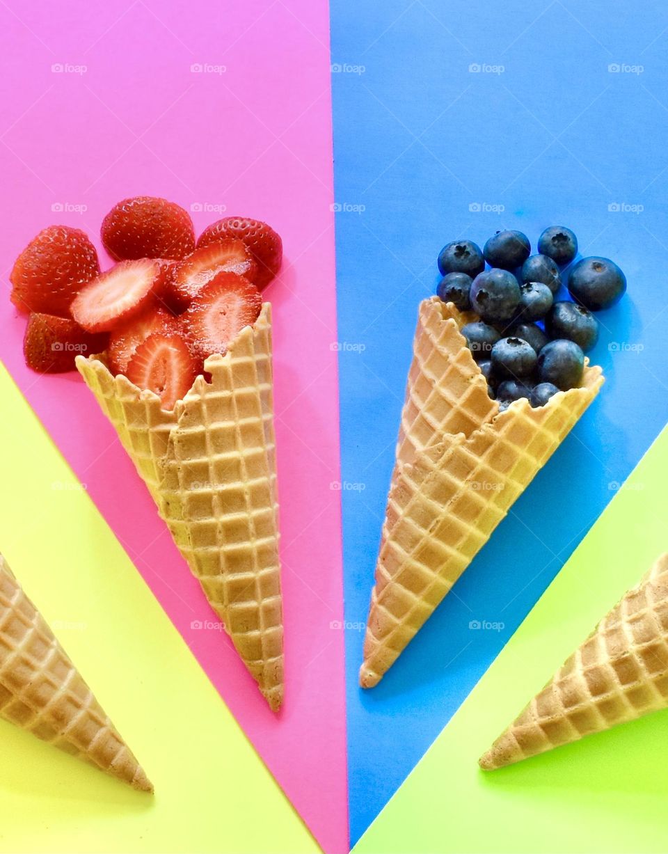 Refreshing summer treat, healthy and colorful fruit in a waffle cone