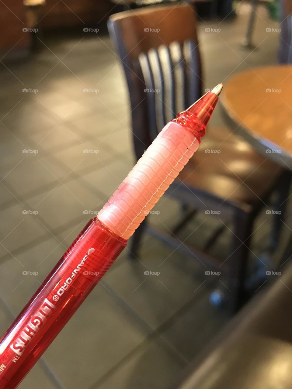 A thick red ink pen that writes pretty good.