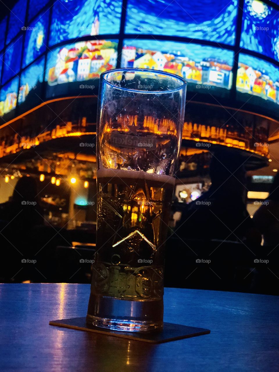 Glass of drink with Van Gogh painting 