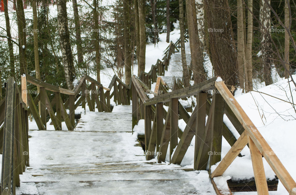 wooden staircase descending from the mountain