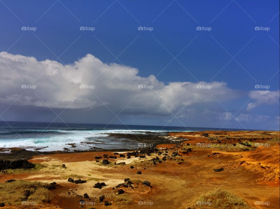 View of sea against blue and cloudy sky