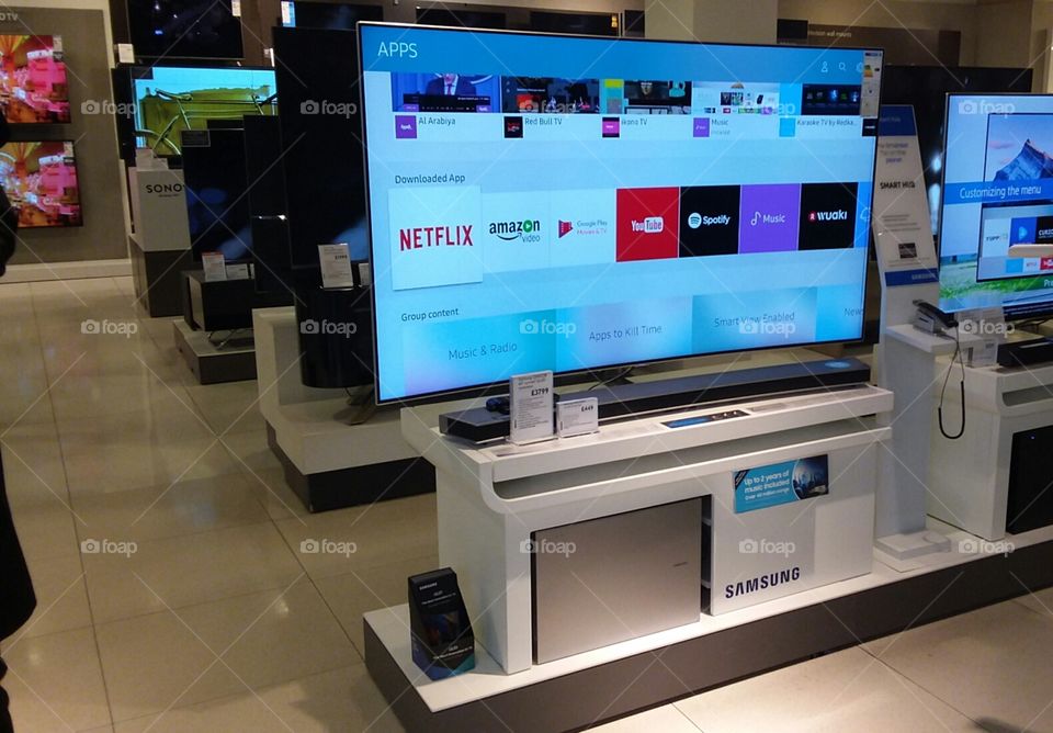 Samsung QLED television 4K Ultra High Definition TV with soundbar and sub-woofer