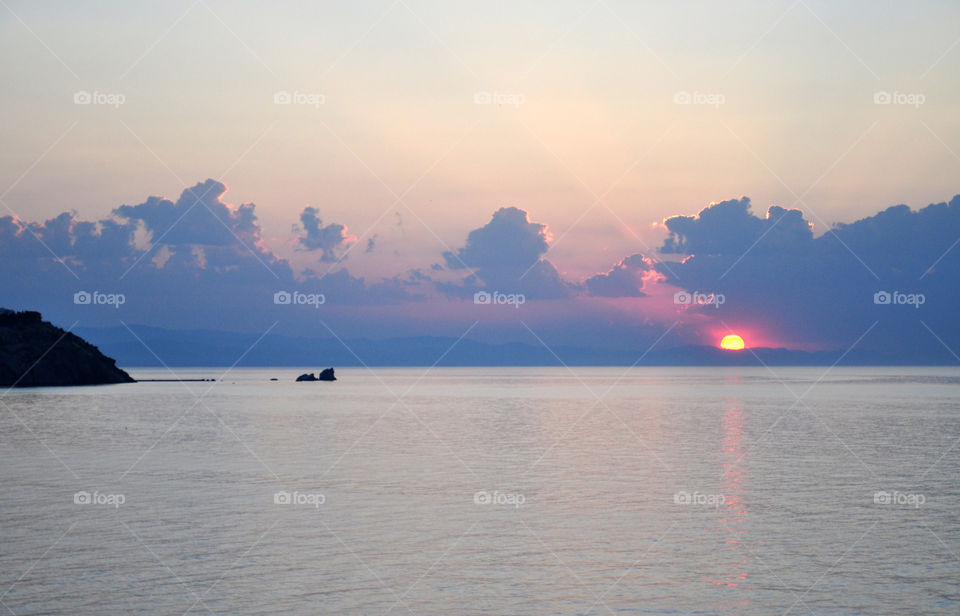 View of calm sea at sunset