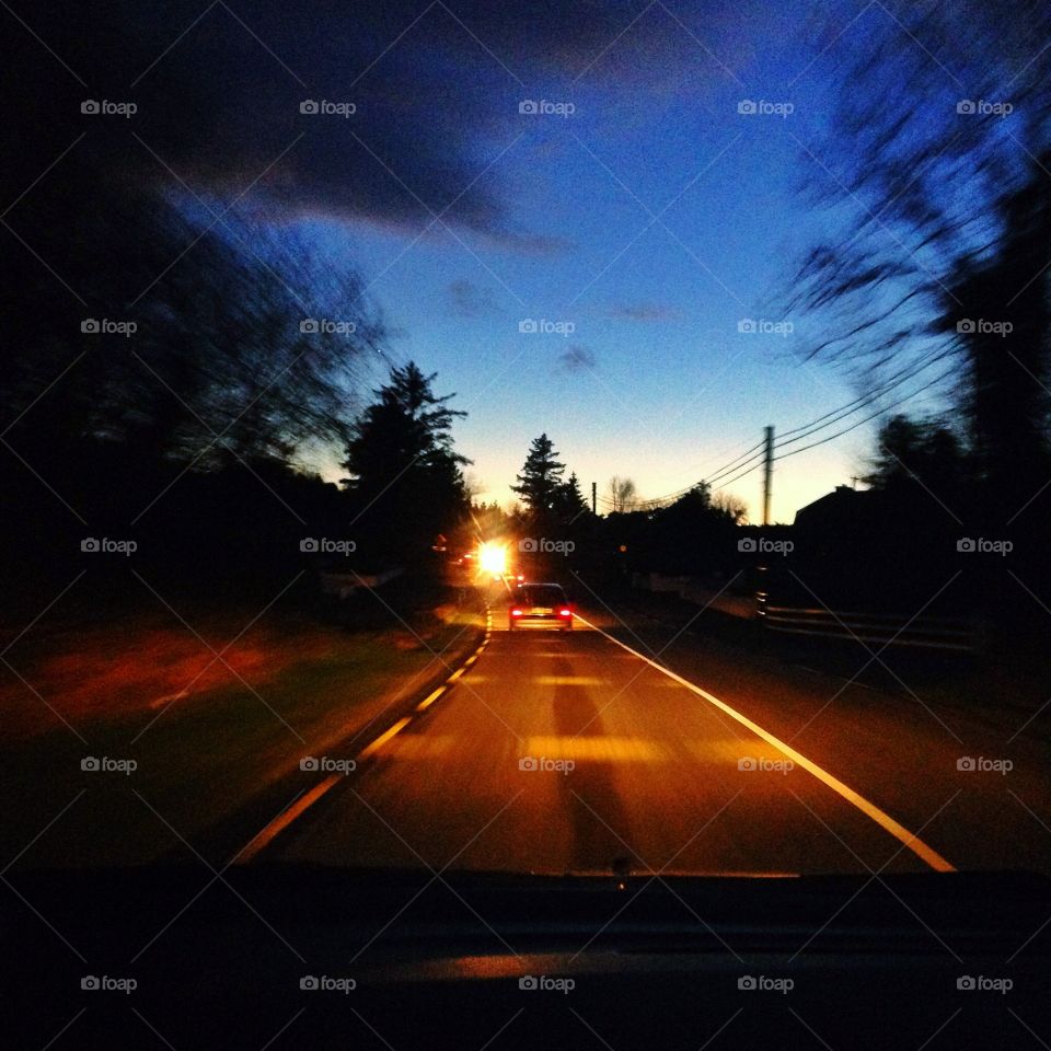 On the road. Driving at twilight view of the road