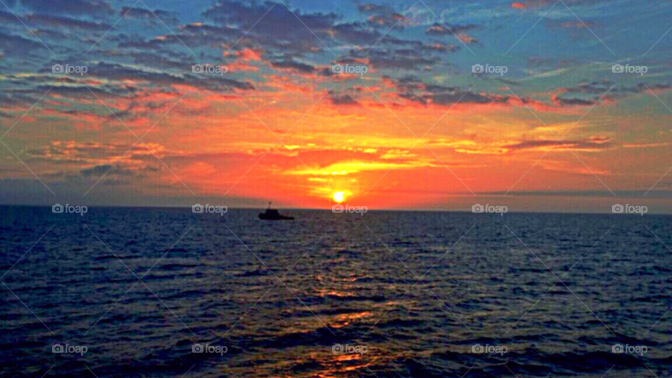 Fire in the sky. Working on a windfarm in the baltic sea. Rewarding view!