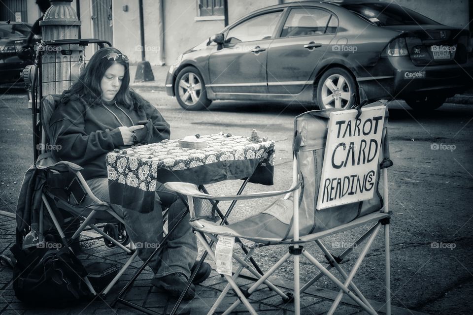 Taro card reader on a roadside in the French Quarter, New Orleans, Louisiana, USA.