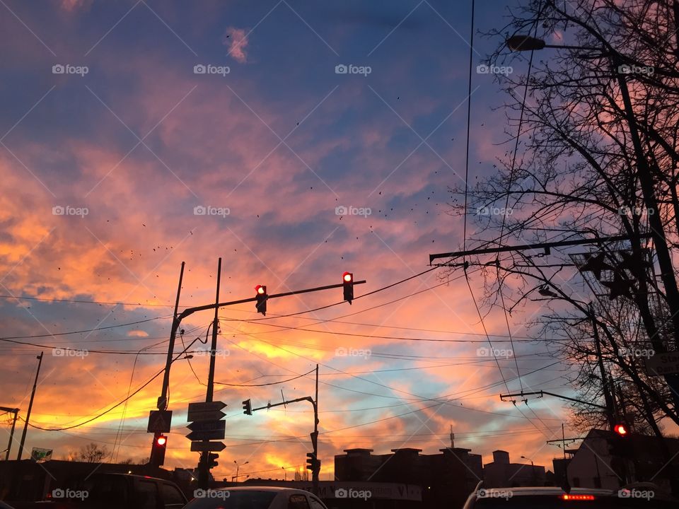 Bright orange sunset in traffic